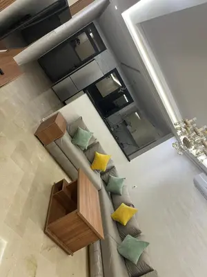 an overhead view of a living room with a couch and yellow pillows at Residence miraj 24 in Marrakech