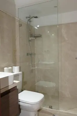 a bathroom with a toilet and a glass shower at Mamounia loft by M&I in Marrakech