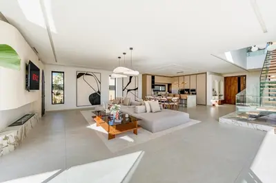 a living room with a couch and a table at Villa Lilas-Luxe Pool, Steam Room & Gym in Segraga