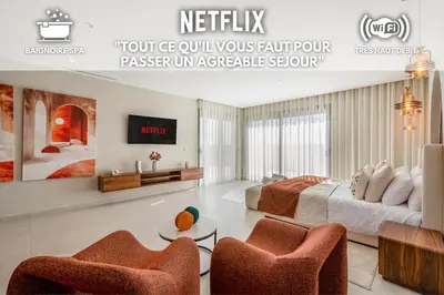 a bedroom with a bed and two chairs at Villa Lilas-Luxe Pool, Steam Room & Gym in Segraga