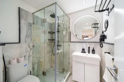 a bathroom with a shower and a toilet and a sink at Gueliz Prime 2BR Perfect Central Stay in Marrakech in Marrakech
