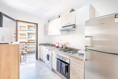 a kitchen with a stainless steel refrigerator and a dishwasher at Appartement Chic & Cosy Hivernage in Marrakech
