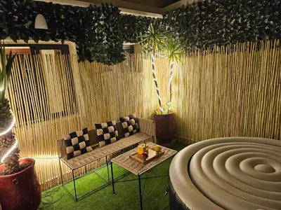 a room with a couch and a table in a room at Appartement 3 chambres jaccuzi in Marrakech