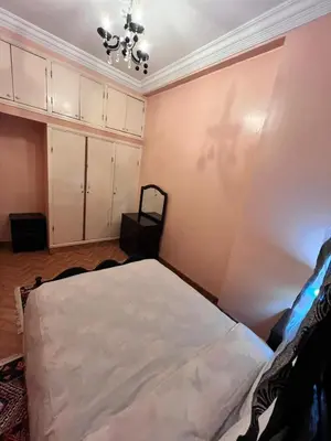 a bedroom with a bed in a room at Tumsilt in Marrakech