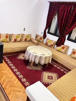 a living room with a couch and a table at Tumsilt in Marrakech