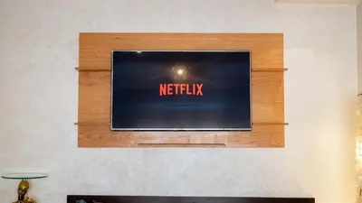 a television screen with the words netflix on a wall at Best Location in Marrakech! Modern Chic Apartment in Marrakech