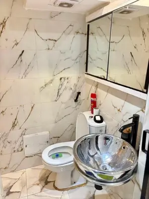 a bathroom with a sink and a toilet at Madame plaza in Marrakech