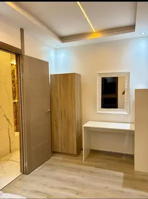a bathroom with a sink and a mirror and a window at Madame plaza in Marrakech