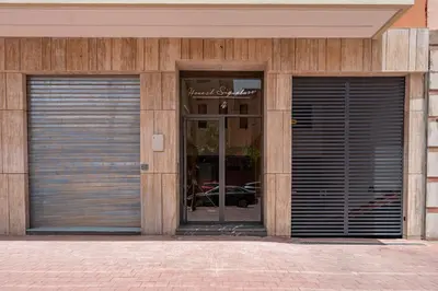 a building with two garage doors in front at Guéliz Centre Haut Standing in Marrakech