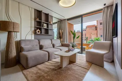 a living room with a couch and a table at Guéliz Centre Haut Standing in Marrakech