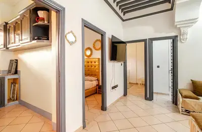 a hallway with a living room and a bedroom at Stay here in Marrakech