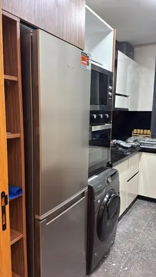 a kitchen with a stainless steel refrigerator and a stove at Elite garden Stylish Unique Appartement in Marrakech