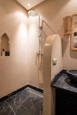 a bathroom with a sink and a shower at Riad Bloom in Marrakech