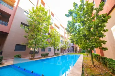 a swimming pool in the middle of a building at La citrine A in Marrakech