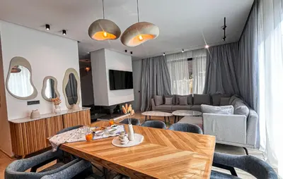 a living room with a table and a couch at Villa de prestige avec piscine privée in Marrakech