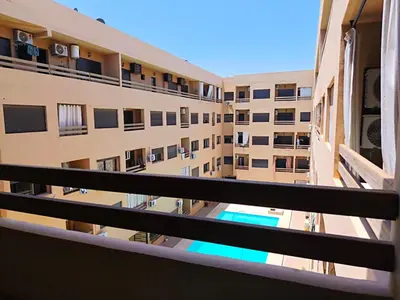 a view from the balcony of a apartment building at Hypercenter Comfy apartment Marrakech pool in Marrakech