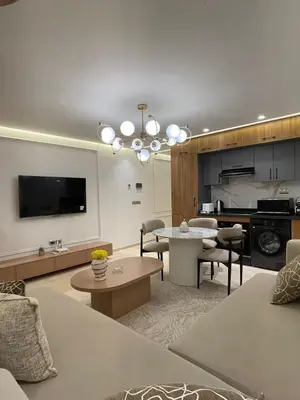 a living room with a couch and a table at City Luxe Studio in Marrakech