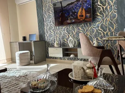 a living room with a table with cookies on it at Appartement de luxe dans le centre de Marrakech in Marrakech