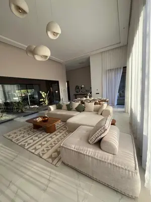a living room with a couch and a table at Villa Signature in Marrakech
