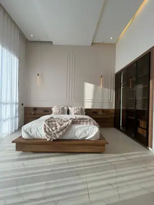 a bedroom with a large bed with white sheets at Villa Signature in Marrakech