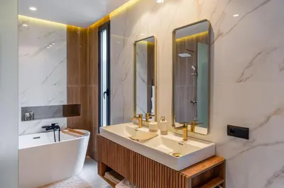 a bathroom with a white sink and a tub and a sinkonnaissance at Villa Kniza Luxury Stay, Courtyard, Pool and View in Marrakech