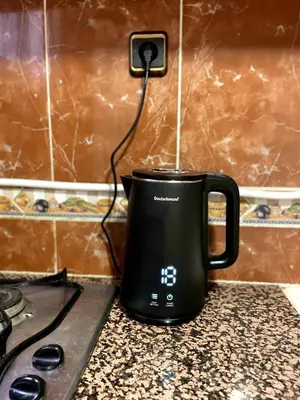 a black coffee pot sitting on a kitchen counter at Riad Red Diamond in Marrakech