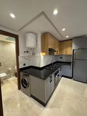 a large kitchen with a washer and dryer in it at for you - perfect place in Marrakech