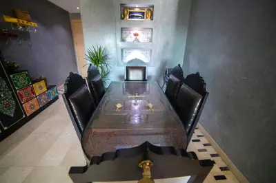 a conference room with a long table and chairs at Prestigia golf city marrakech in Marrakech