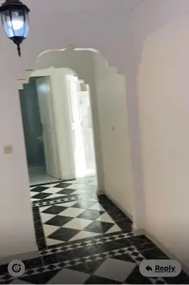 a hallway with a black and white checkered floor at Marrakech 2 bedroom flat in Marrakech