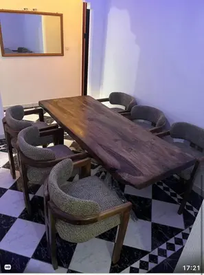 a conference room with a wooden table and chairs at Marrakech 2 bedroom flat in Marrakech
