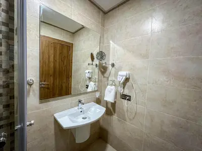 a bathroom with a sink and a mirror at Well equipped luxury apartment in centre marrakech ctm aeroport train medina in Marrakech