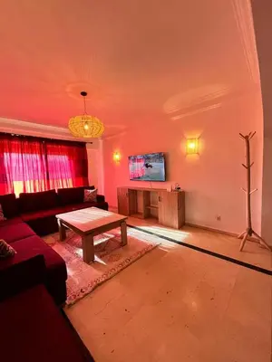 a living room with a couch and a table at Appartement Majorelle in Marrakech