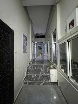 a hallway of a building with a door and stairs at 2 bedroom apartment in a perfect location in Marrakech