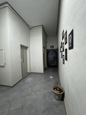 a hallway with a plant in a pot on a wall at 2 bedroom apartment in a perfect location in Marrakech