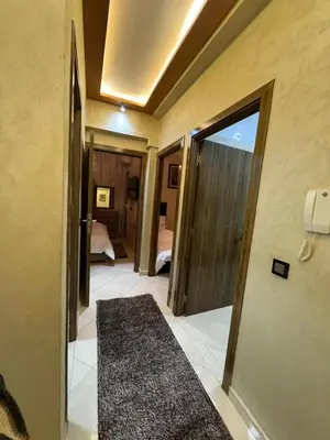 a hallway with a door open to a bedroom at 2 bedroom apartment in a perfect location in Marrakech