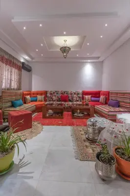 a large living room with couches and tables at Dar Choway in Marrakech