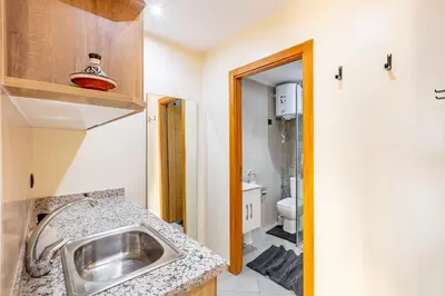 a bathroom with a sink and a toilet at Warm Nest 8 Comfort And Luxury in Oulad Akkou