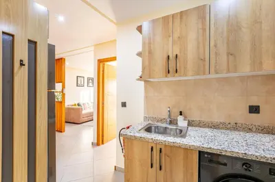 a kitchen with a sink and a counter at Warm Nest 8 Comfort And Luxury in Oulad Akkou