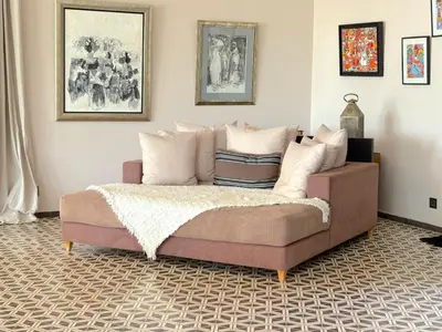 a bedroom with a bed with pillows on it at Palais Meryem in Marrakech