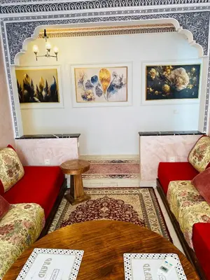 a living room with two couches and a table at Moroccan-style apartment rental in Marrakech in Marrakech