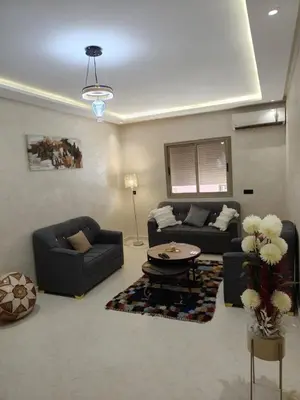 a living room with two couches and a table at arrive as a guest , turn to a local in Marrakech