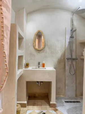 a bathroom with a sink and a shower at Riad Marhaba in Marrakech