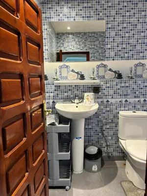 a bathroom with a sink and a toilet at Ryad Karima in Marrakech