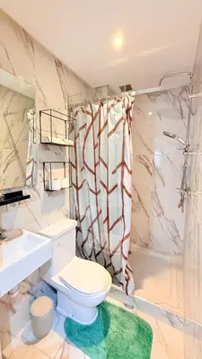 a bathroom with a toilet and a shower at Meriso Downtown Free Parking in Marrakech
