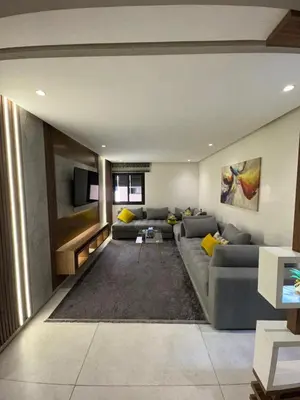 a living room with a gray couch and yellow pillows at Stylish 2-Bed Retreat in Marrakech Free Parking in Marrakech