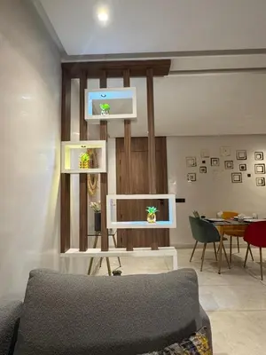 a living room with a couch and a table at Stylish 2-Bed Retreat in Marrakech Free Parking in Marrakech