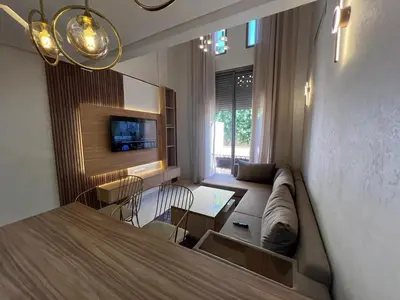 a living room with a couch and a table at Elegant duplex Marrakech in Marrakech