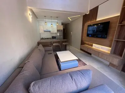 a living room with a couch and a table at Elegant duplex Marrakech in Marrakech