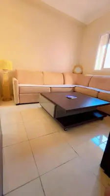 a living room with a couch and a coffee table at Apartment near Mènera gardens and city center in Marrakech