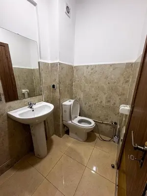 a bathroom with a toilet and a sink at Apartment in Marrakech near McDonald's Massira in Marrakech